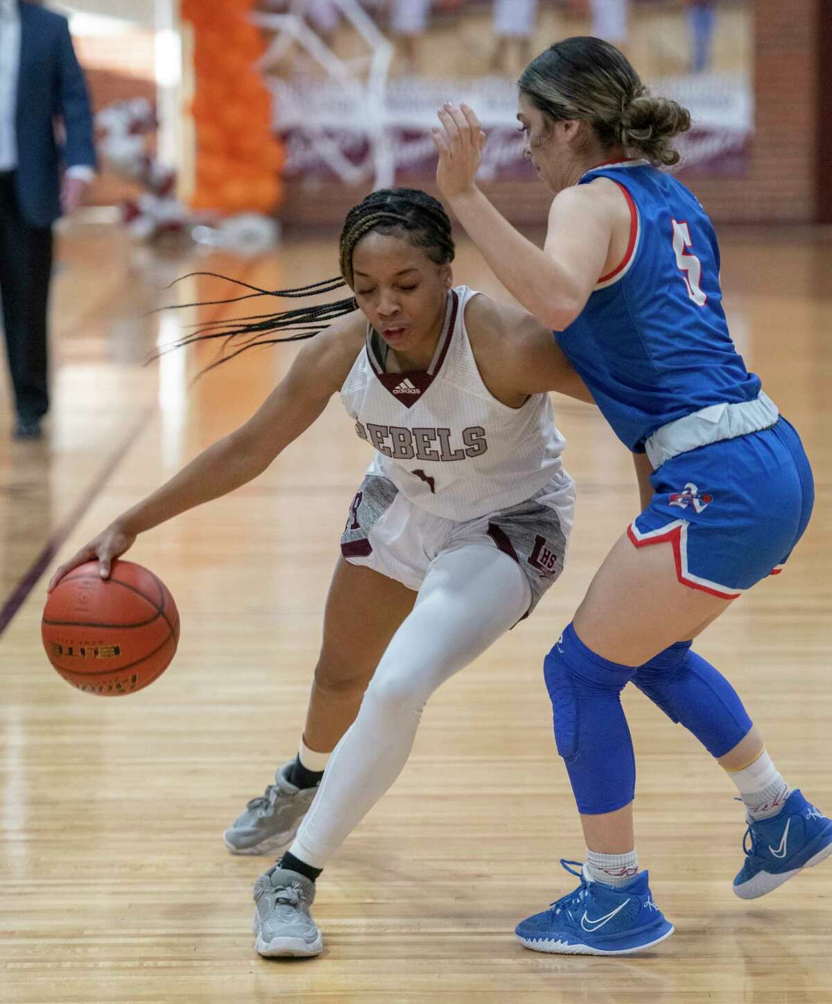 Legacy High's Myleah Young brings the ball down court as El Paso Americas' Brianna Melina Garcia defends 02/15/2022 at the Rebel Gymnasium. Tim Fischer/Reporter-Telegram