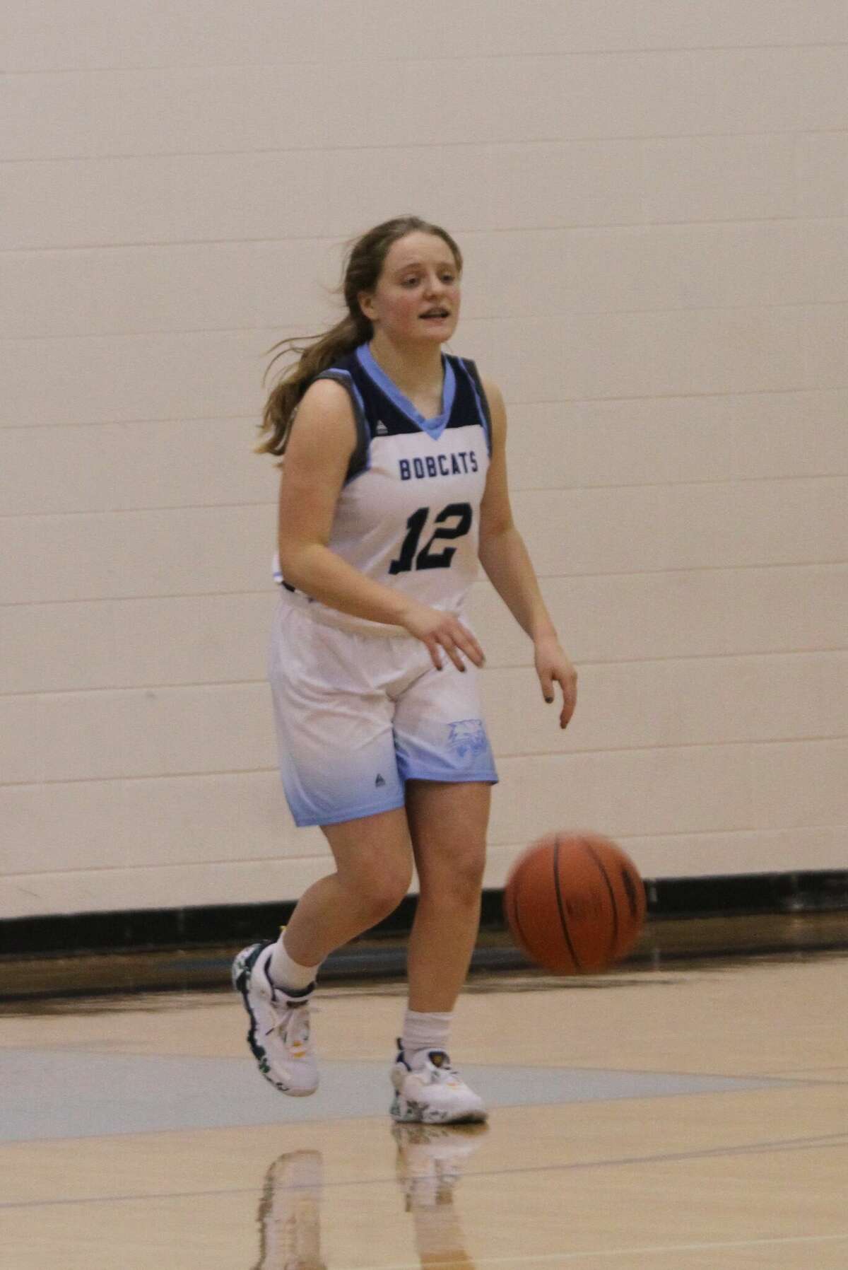 Brethren freshman Alice Amstutz brings the ball up the court in the Bobcats 44-14 victory over Bear Lake on Tuesday, Feb. 15 at Brethren High School. 