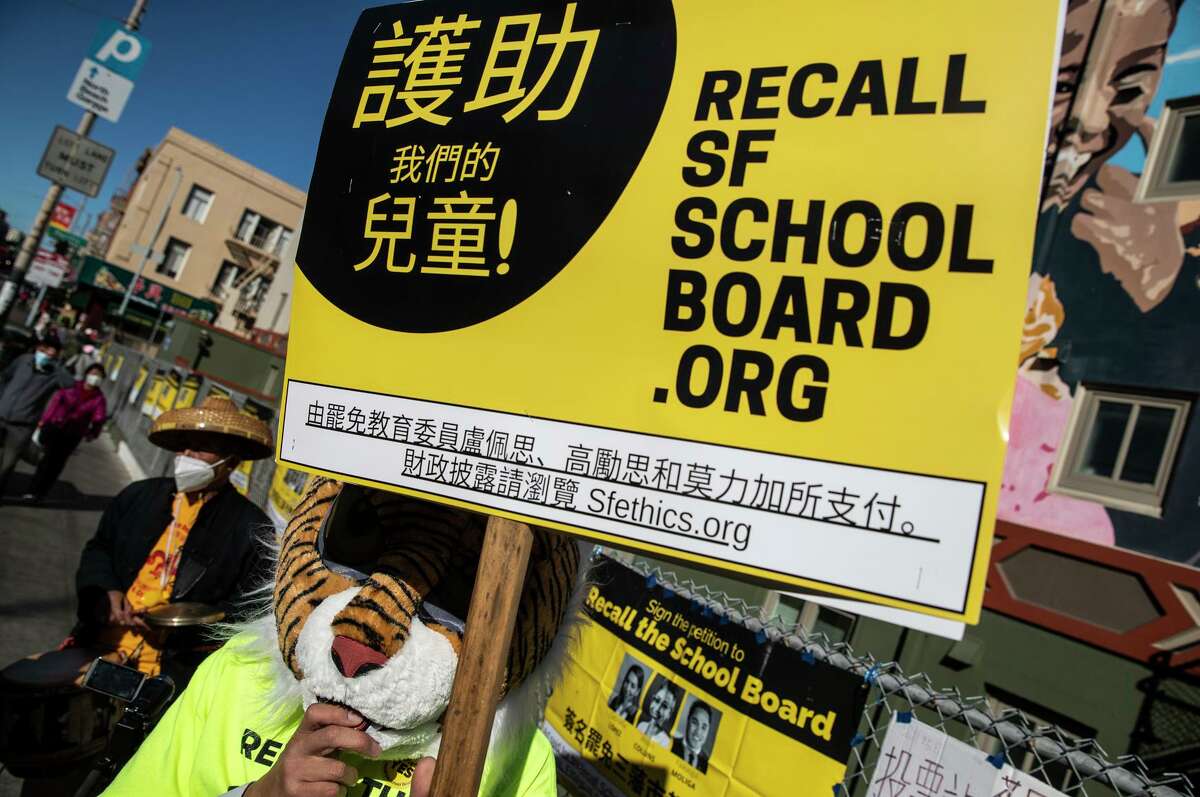 San Francisco school board recall supporter Laurence Lee canvasses Chinatown on Tuesday. Board members Alison Collins, Gabriela López and Faauuga Moliga were defeated in a recall vote.