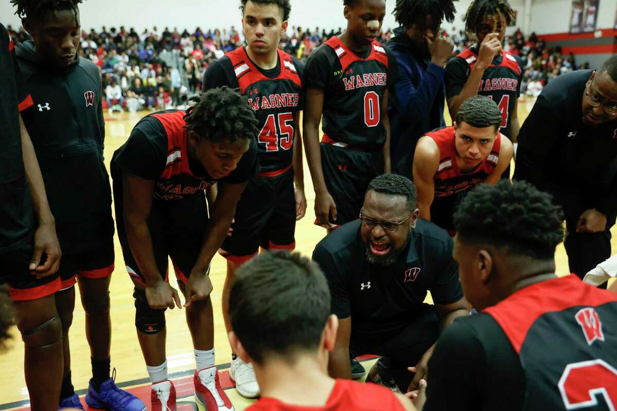 Wagner head coach Rodney Clark talks to his team during a first quarter timeout during the game against the Judson Rockets at Judson High School in San Antonio, Texas, Tuesday, Feb. 15, 2022. The Rockets defeated the Thunderbirds 69-58 to take the 27-6A district championship title.