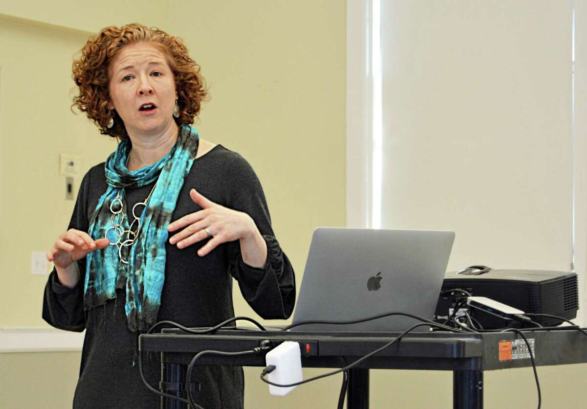 Erin Boggs of the Open Communities Alliance speaks in February 2019 in Middletown, Conn.
