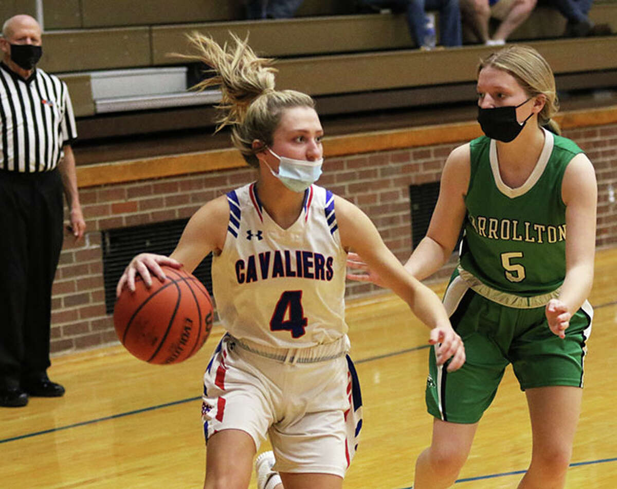Carlinville's Jill Stayton (4), shown driving on Carrollton's Lauren Walker in a game earlier this season at Carlinville, scored 16 points in the Cavaliers come-from-behind win over South County at the Hillsboro Class 2A Regional.