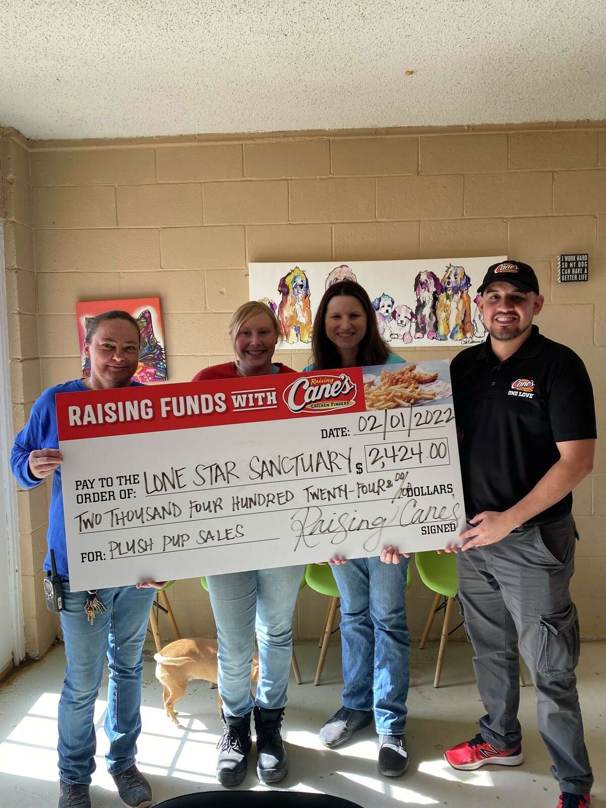 A check from Raising Cane's to Lone Star Sanctuary was presented for $2,500. 