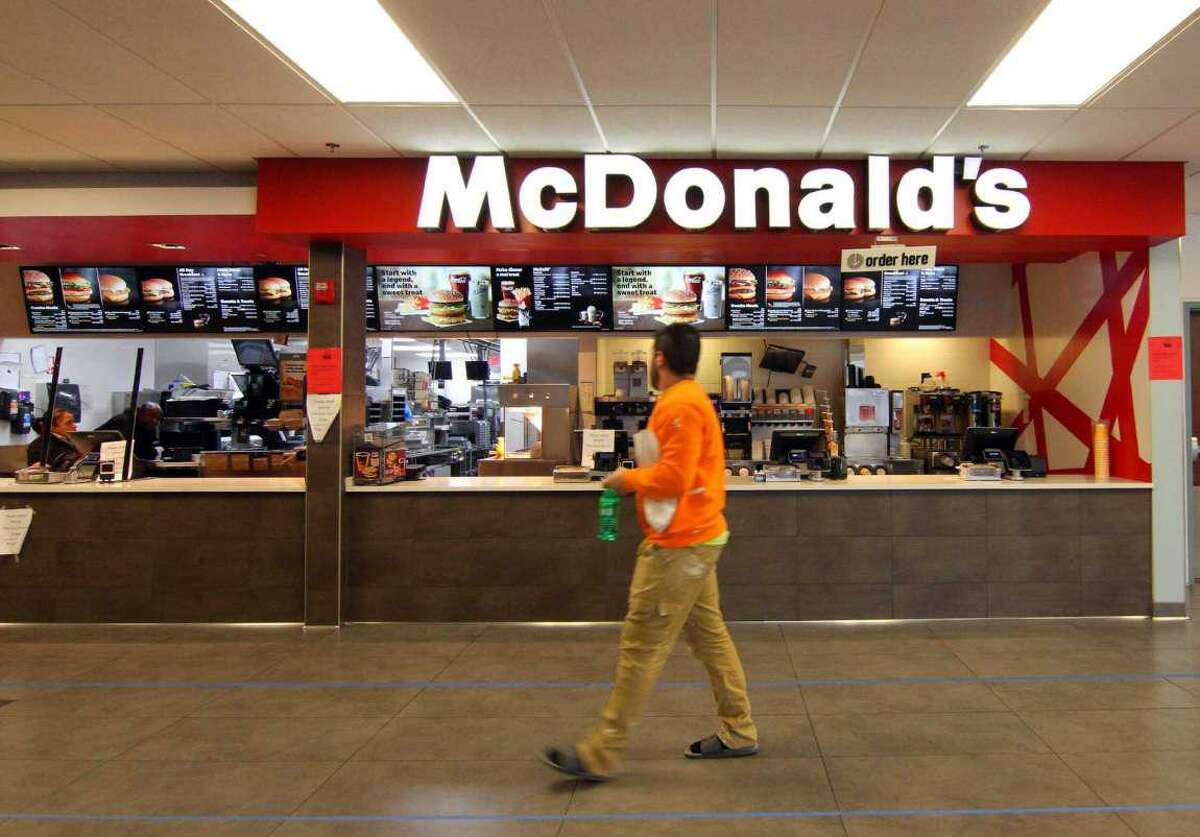 A customer walks past a McDonald’s restaurant located in the Milford rest stop on I-95 on Thursday, March 2 2020.