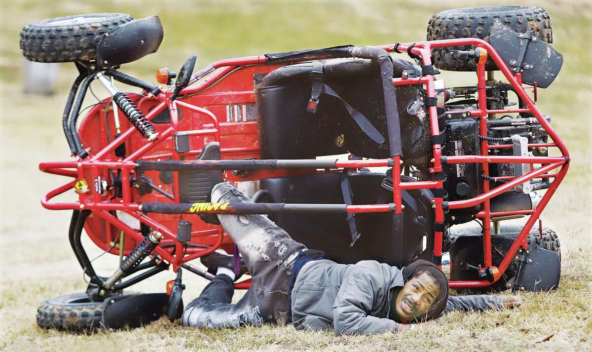 John Badman|The Telegraph A man who went four-wheeling through Alton's Norside Park about noon Wednesday got trapped when his vehicle overturned. The man, whose name was not released, suffered no serious injuries and walked to an Alton Fire Department ambulance after firefighters righted the vehicle and freed him. The four-wheeler overturned near the park's ball diamond; no one else was injured. 