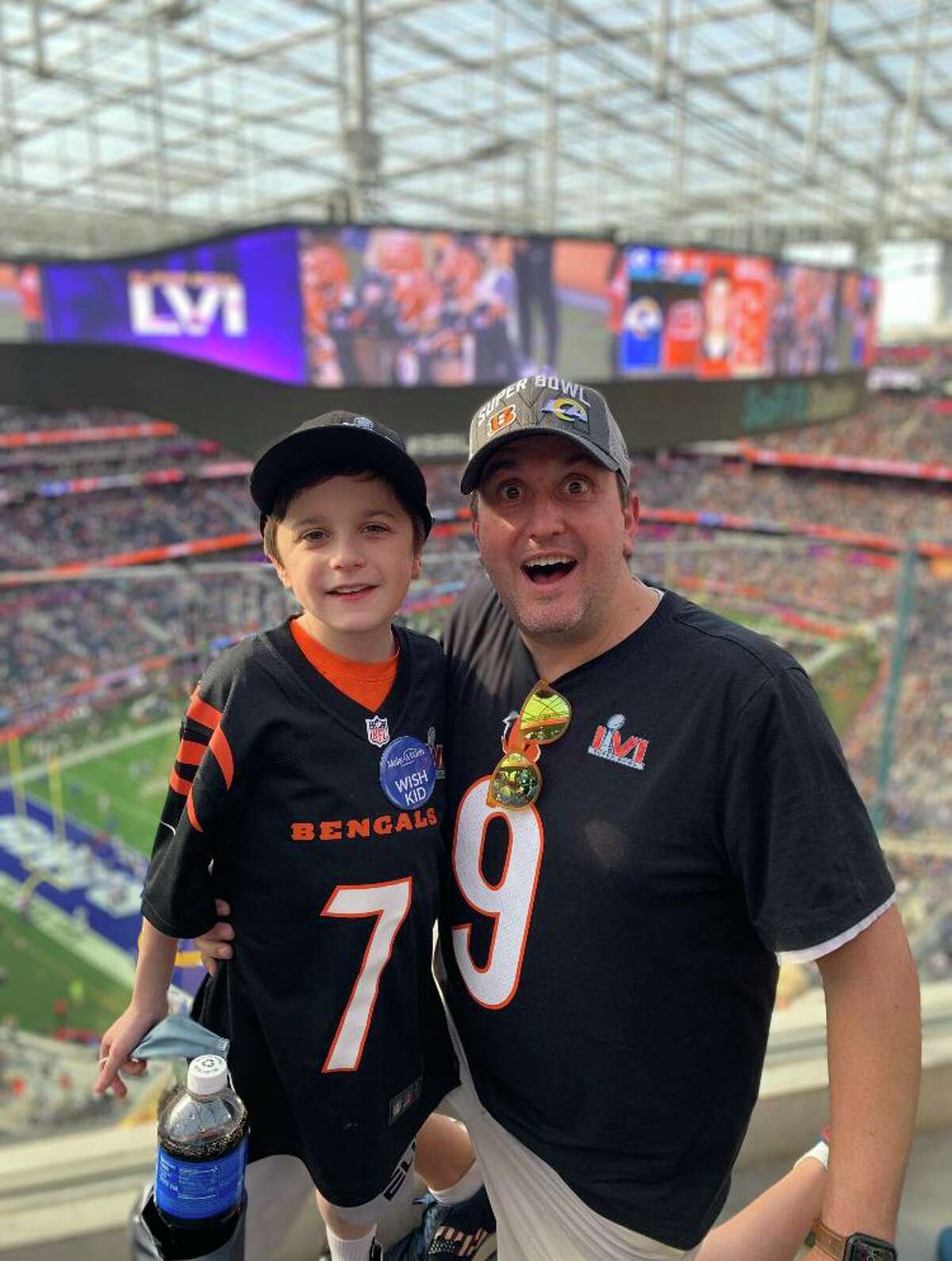 Conner Curran, left, and his father, Chris, attended Super Bowl LVI on behalf of the Make-A-Wish Foundation.