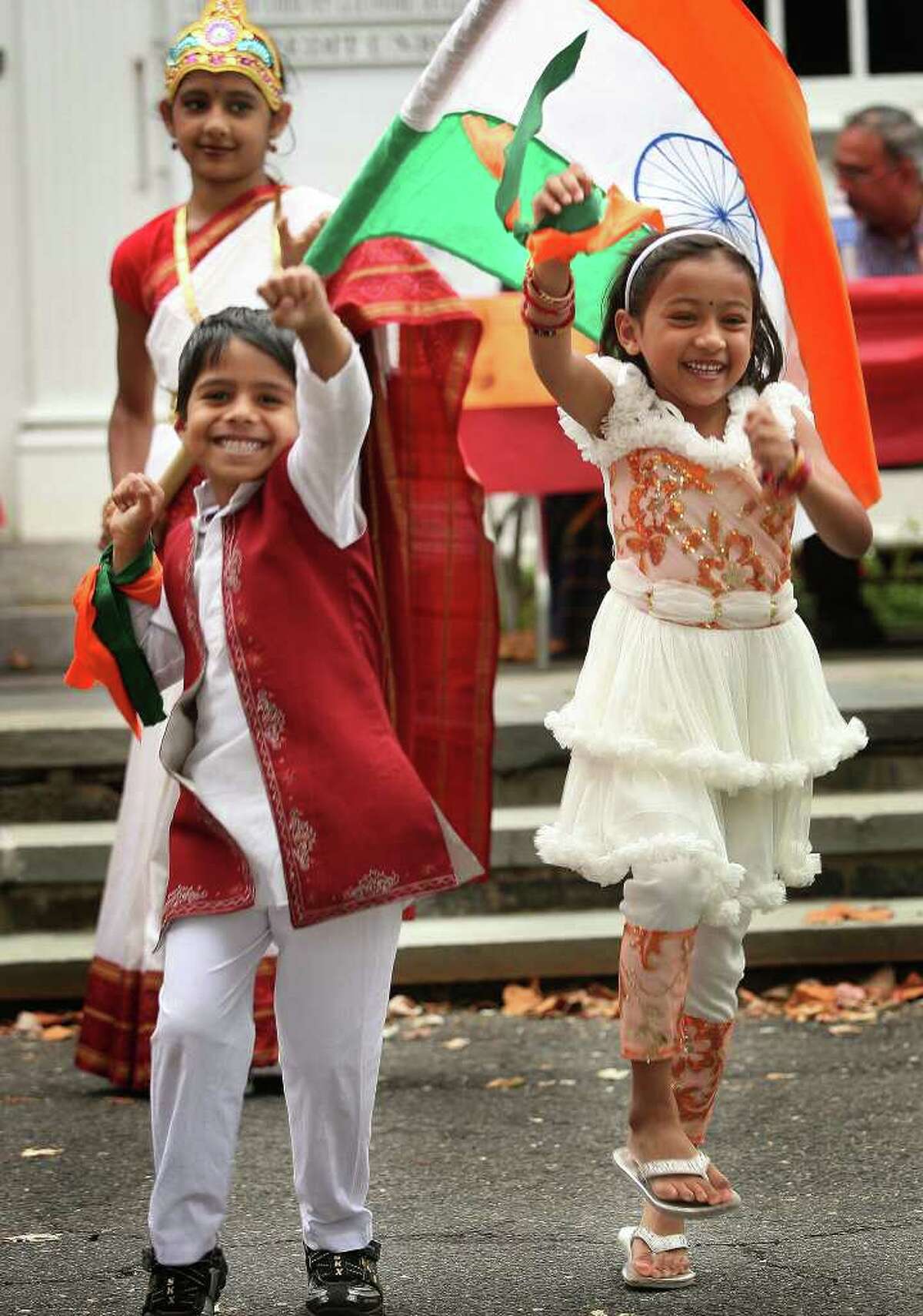 Shiva Subramanian, 5 of Trumbull, and Aarushi Agarwal, 4 of Norwalk, dance at the Hindu Cultural Center of Connecticut's annual Heritage India Festival on the Town Hall Green in Fairfield on Sunday, September 28, 2010. Behind is Shreya Chopra, 10 of Trumbull, dressed as Mother India.