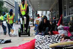 Frustration mounts over rules on sitting on downtown sidewalks