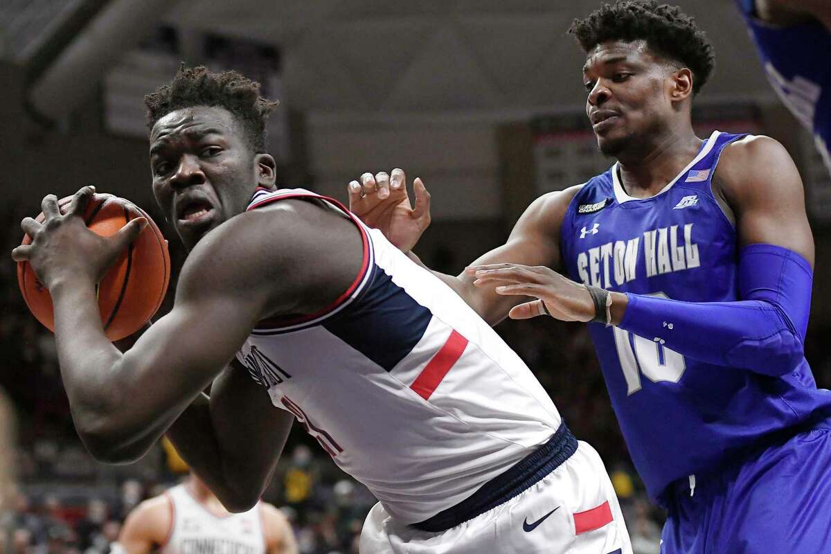 UConn’s Adama Sanogo is guarded by Seton Hall's Alexis Yetna (10) on Wednesday at Gampel Pavilion in Storrs.