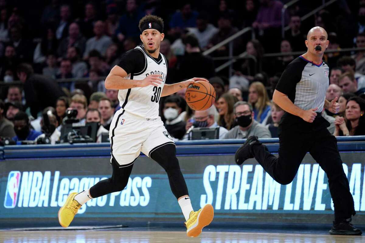 Brookln guard Seth Curry, dribbling upcourt during the first half against the Knicks, had 20 points to lead a 111-106 victory.