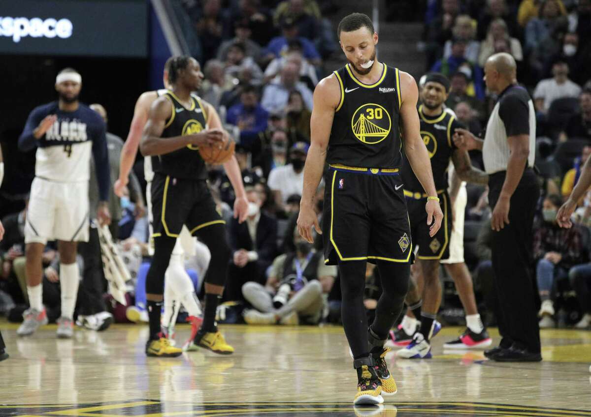 Stephen Curry (30) reacts to a flagrant foul against Jonathan Kuminga (00) in the first half as the Golden State Warriors played the Denver Nuggets at Chase Center in San Francisco, Calif., on Wednesday, February 16, 2022.