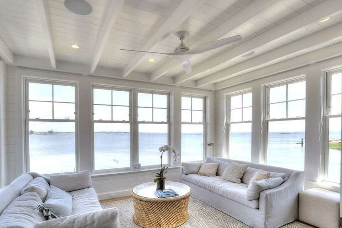 The sunroom, which seems to sit right on the water, is one of the family’s favorite locations in the house. 