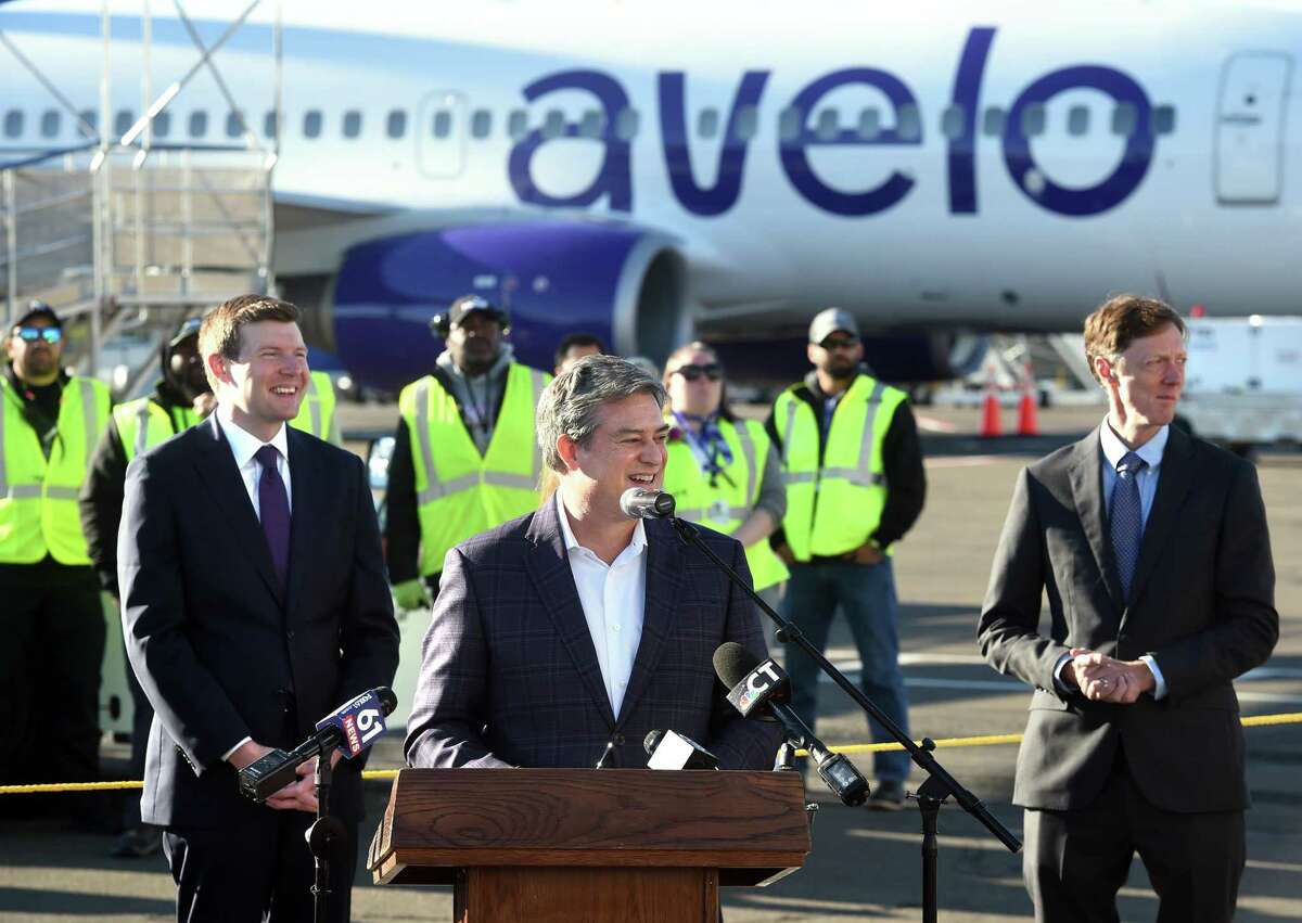 Avelo Airlines Chairman and CEO Andrew Levy (center) speaks during a ceremony before the Avelo Airlines inaugural flight from Tweed New Haven Regional Airport to Orlando on November 3, 2021.