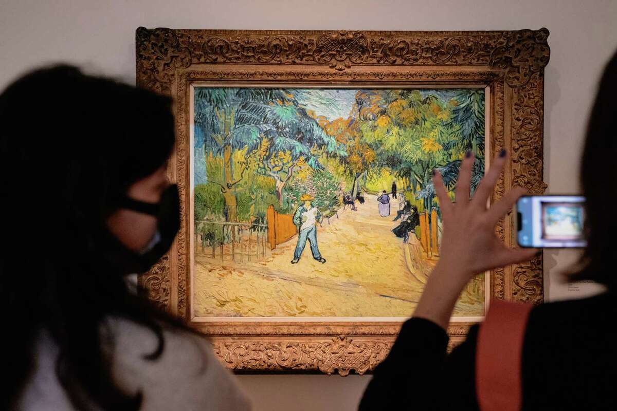 At the Phillips Collection, visitors snap pictures of Van Gogh's "Entrance to the Public Gardens in Arles."