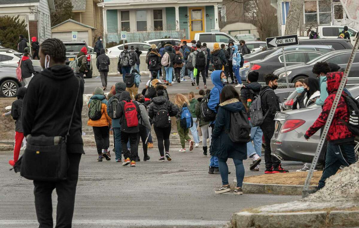 Students are seen leaving Albany High School in an early dismissal after a lockdown on Thursday, Feb. 17, 2022. The lockdown happened after a fight involving a knife. Schools have worked to try to address discipline issues as the pandemic absences and protocols caused stresses.
