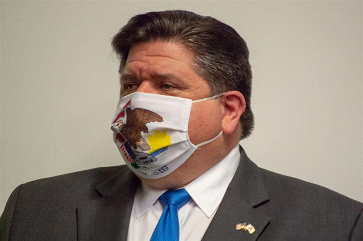 Gov. JB Pritzker is pictured wearing a face covering at a news conference in Springfield in 2020. 