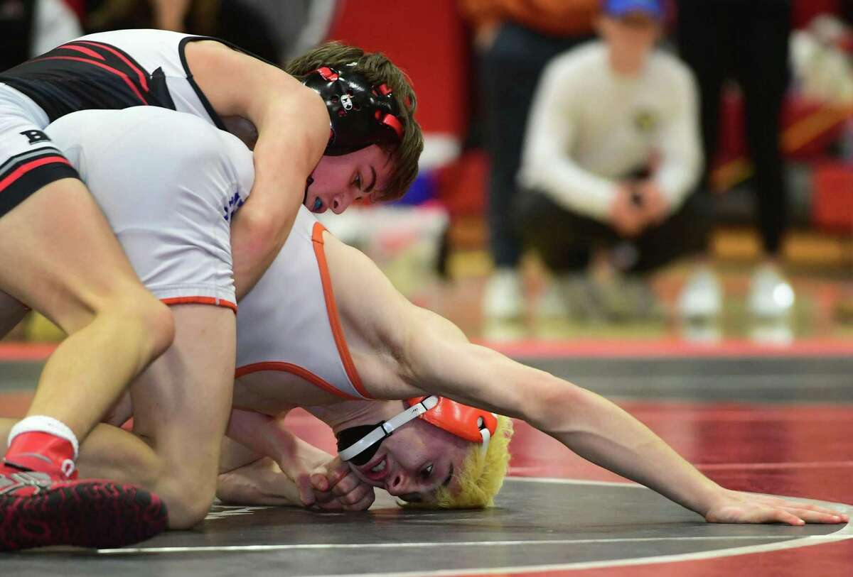 Fairfield Warde High School wrestler Lucas Coleman wrestles Kai O'Dell of Danbury in the 113 lbs bout during the FCIAC wrestling championships Saturday, February 15, 2020, at New Canaan High School in New Canaan, Conn.