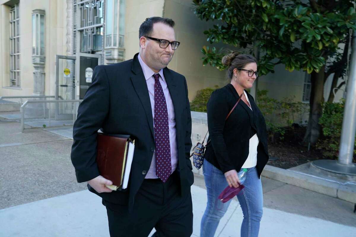 Former Los Angeles Angels employee Eric Kay, left, walks out of a federal court building where he is on trial for federal drug distribution and conspiracy charges, in Fort Worth, Texas, Tuesday, Feb. 15, 2022. Kay is accused of providing Tyler Skaggs the drugs that led to the pitcher's overdose death. The 27-year-old Skaggs was found dead in July 2019 in a suburban Dallas hotel room. He had choked to death on his vomit, and a toxic mix of alcohol, fentanyl and oxycodone was in his system.