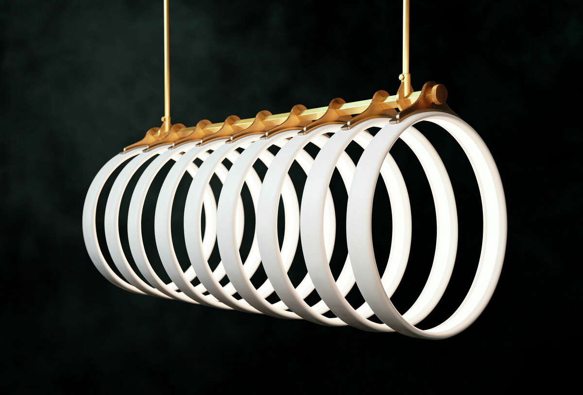 Ted Bradley's Samsara light fixture is made of porcelain and metal, inspired by the arching ribs of a whale skeleton bleached in the sun.