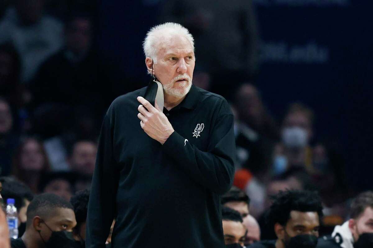 San Antonio Spurs head coach Gregg Popovich stands on the sideline against the Cleveland Cavaliers during the first half of an NBA basketball game, Wednesday, Feb. 9, 2022, in Cleveland. (AP Photo/Ron Schwane)