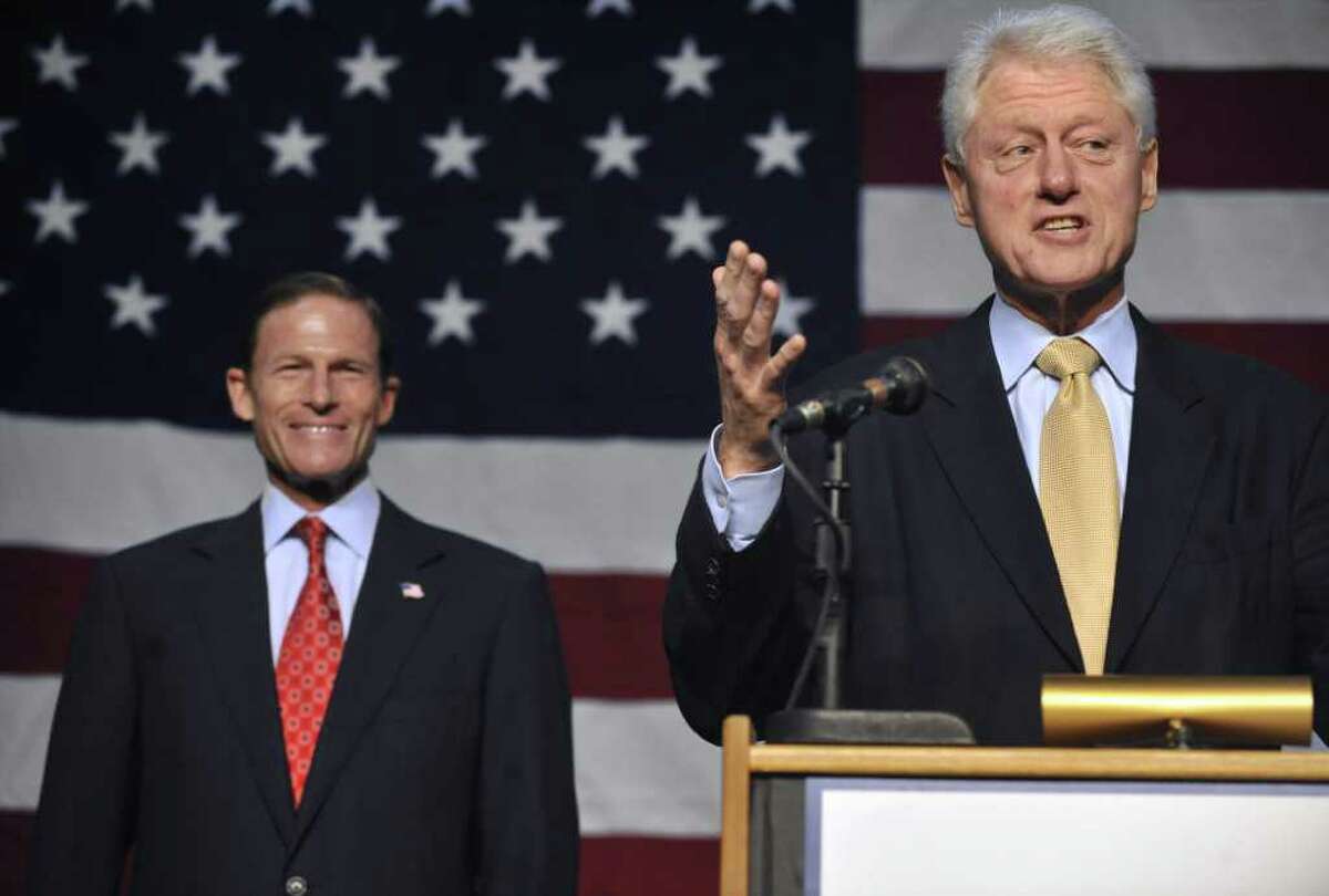 Former President Bill Clinton, right, speaks during an event for Democratic U.S. Senate candidate Richard Blumenthal, left, in New Haven, Conn., on Sunday, Sept. 26, 2010. (AP Photo/Jessica Hill)