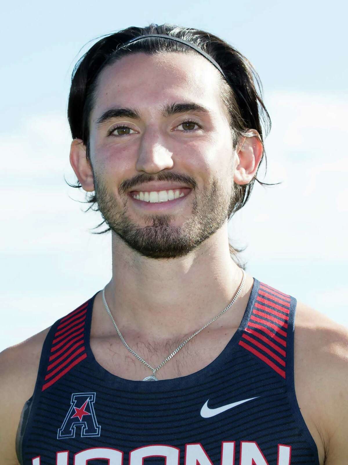 Norwalk runner Eric van der Els breaks UConn’s record in the mile