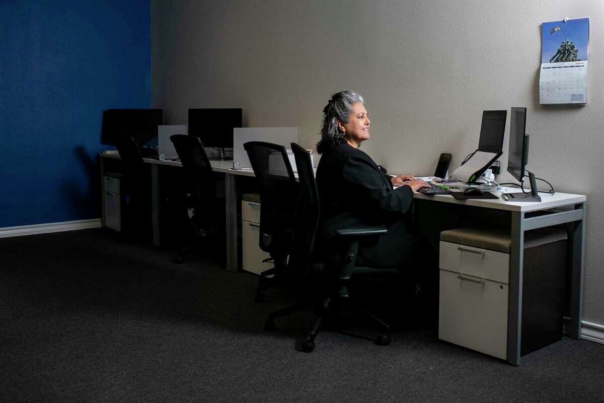 Melissa Farias, 58, is pictured in her office at Endeavors in San Antonio, Texas, on Feb. 4, 2022. Farias was laid off early in the pandemic and was struggling financially before she enrolled in training for marketing through the city's Train for Jobs program and landed a job with Endeavors after she gradauted from training with her associates in accounting technology ast fall. She is now working full-time and pursuing a bachelors from UTSA.