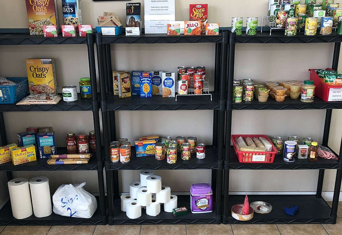 Shelves filled with canned goods, non-perishable foods and personal care items sit stocked at New Berlin Laundromat.