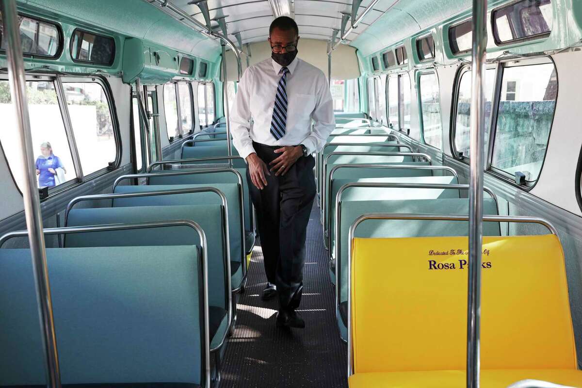 Ken Stewart takes a tour of the VIA Metropolitan Transit vintage 1966 Dreamliner bus with a bench honoring Rosa Parks, during a tribute in her honor at La Villita on Thursday.