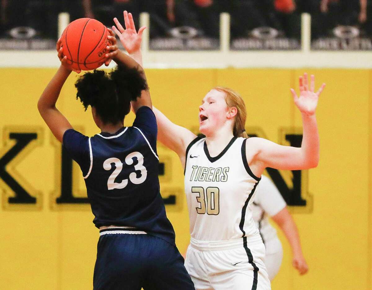 Conroe’s Makenzie Castille (30) pressures Cypress Springs Ayla McDowell (23) during the second quarter of a area high school basketball playoff game, Thursday, Feb. 17, 2022, in Spring.