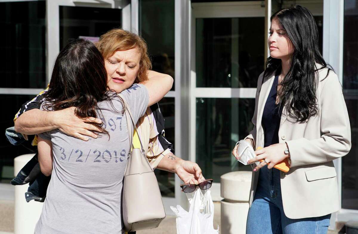 Wyndi Padgett hugs her sister-in-law, Kim Padgett, with her daughter, Kamryn Padgett, shown right, outside the Bob Casey United States Federal Courthouse, 515 Rusk Ave., after sentencing in the death of her son, Blain Padgett, Thursday, Feb. 17, 2022, in Houston. Blain Padgett was found dead inside his Houston apartment on March 2, 2018 after missing football practice at Rice University. A former teammate Stuart “Mooch” Mouchantaf pleaded guilty to opioid charges related to his death.