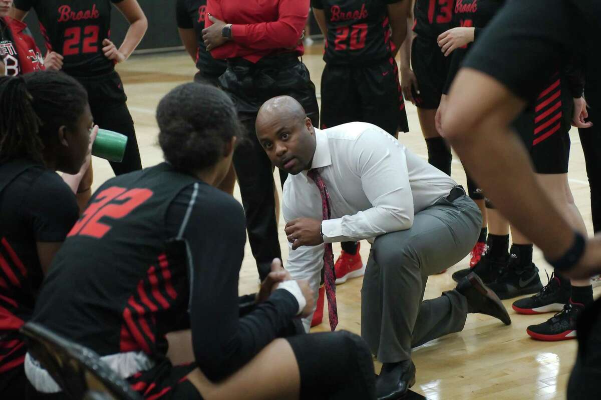 Clear Brook basketball coach Warren Brooks speaks to his team during a break against North Shore Thursday, Feb. 17, 2022 at Pasadena Memorial High School.
