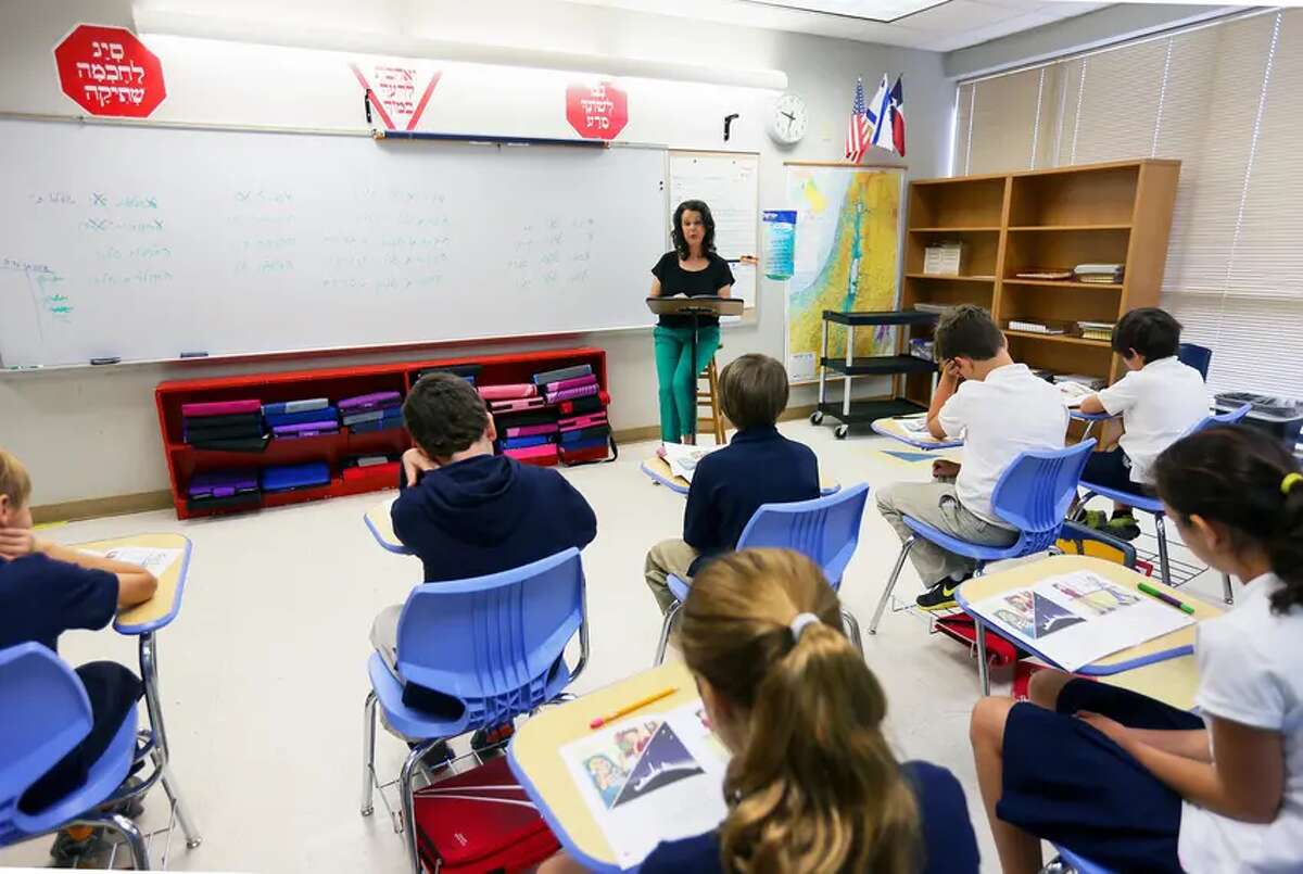 Fifth grade teacher Hagit Lifshitz leads a class in reading a book in Hebrew at Eleanor Kolitz Hebrew Language Academy, a public charter school in San Antonio, in 2013.
