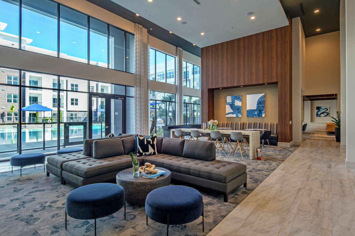 Gathering areas at Domain Heights, with a view of the 9,000 square-foot pool outside.