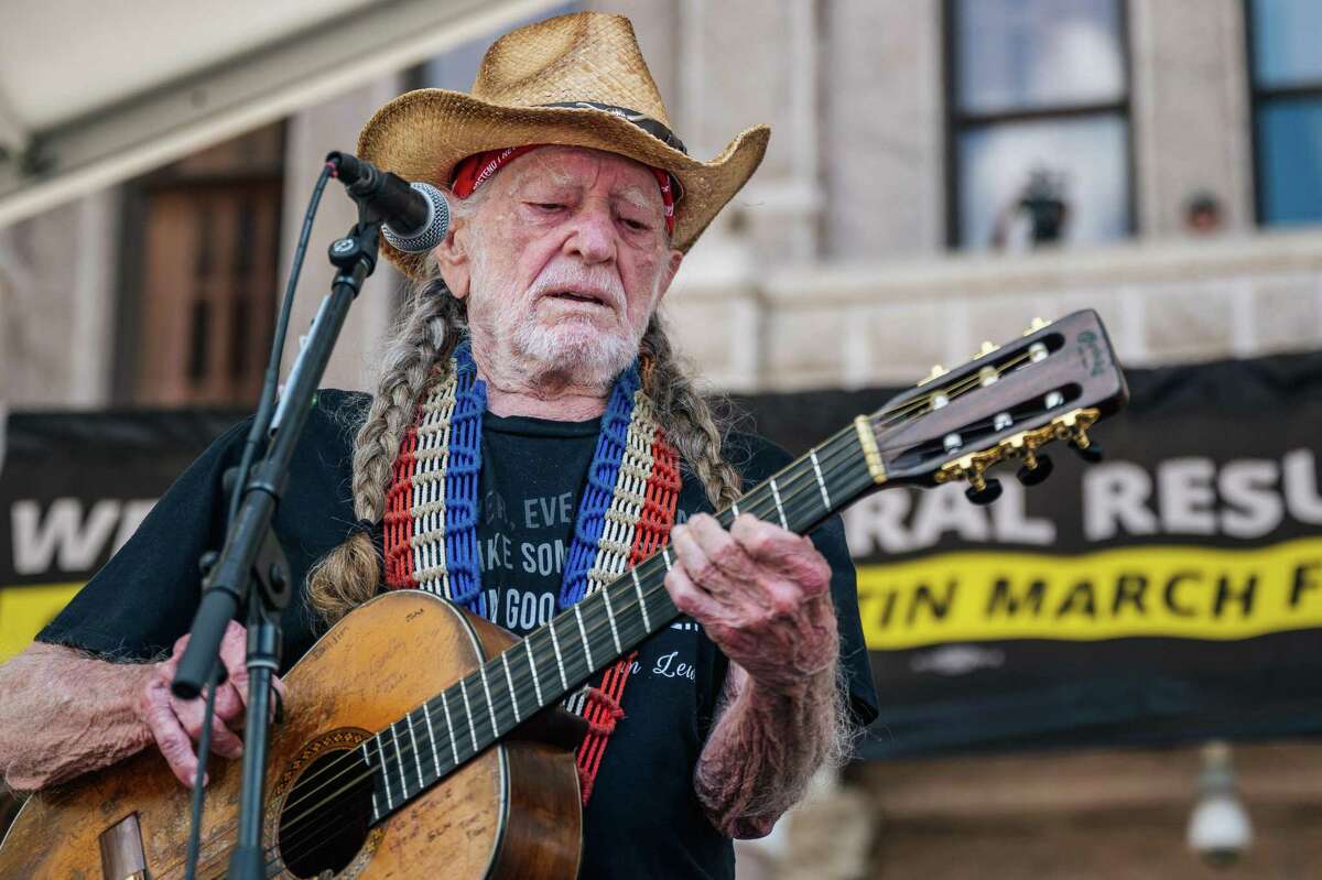 Willie Nelson, shown performing in July 2021 during the Georgetown to Austin March for Democracy rally in Austin, has canceled his shows in San Antonio that were scheduled for March 21 and 22.