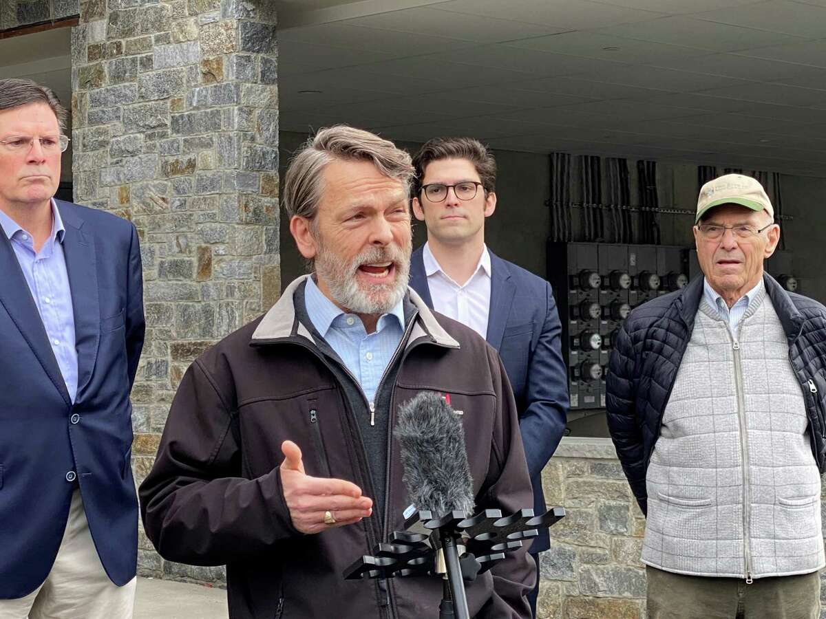 Chairman of the housing authority Scott Hobbs spoke to group of 30 people, including elected officials, who stood in front of Canaan Parish, New Canaan's newest affordable housing, to speak out against the proposed 102-unit, with 31 affordable housing units at 751Weed Street on Feb. 17, 2022