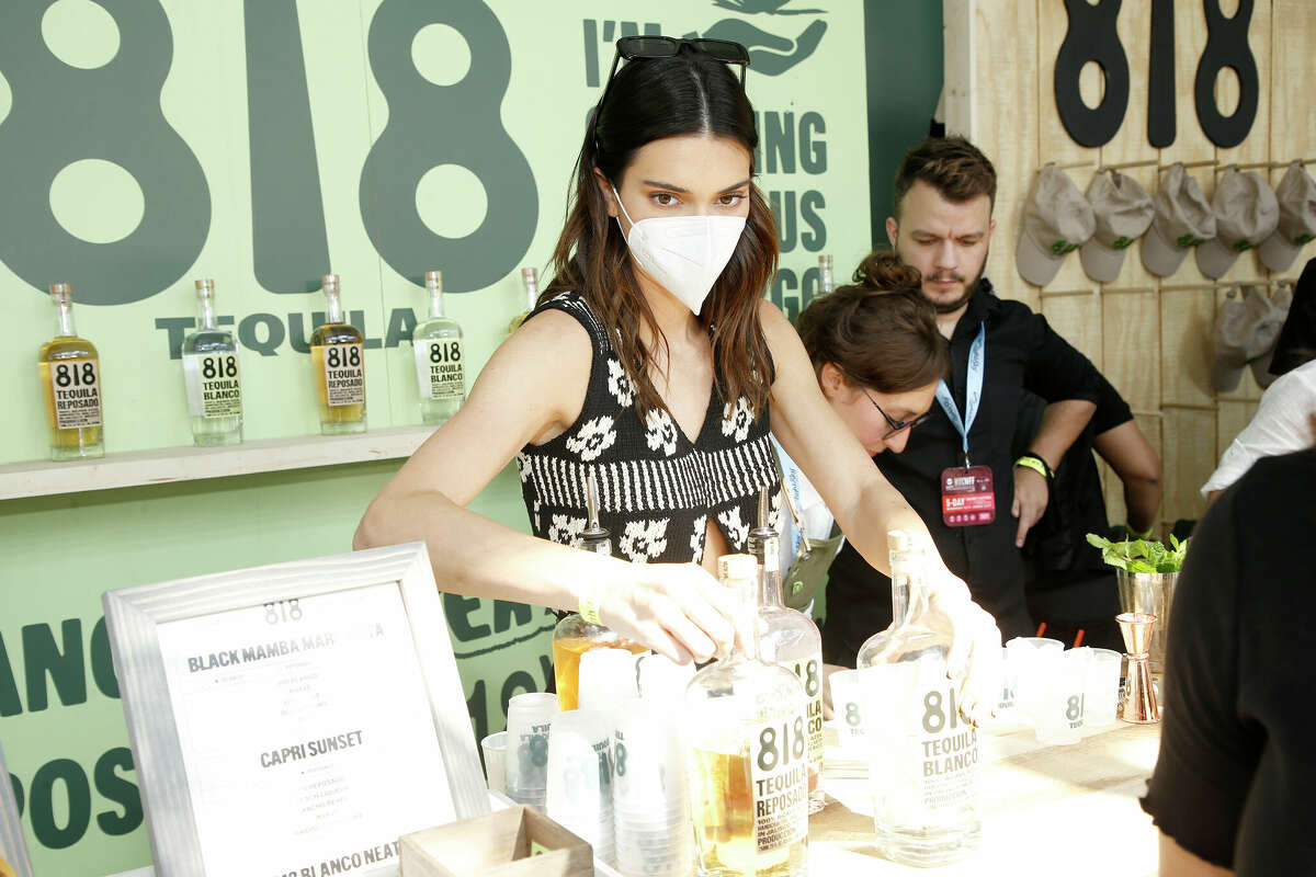Kendall Jenner at the 818 Tequila booth in October. Austin’s Tequila 512 is suing Jenner, alleging her company’s product “simply and blatantly” rips off its branding. 