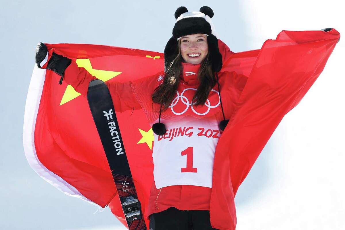 Gold medalist Ailing Eileen Gu of Team China poses during the Women's Freeski Halfpipe flower ceremony during the Beijing 2022 Winter Olympics at Genting Snow Park on Friday, Feb. 18, 2022, in Zhangjiakou, China. (Ezra Shaw/Getty Images/TNS)