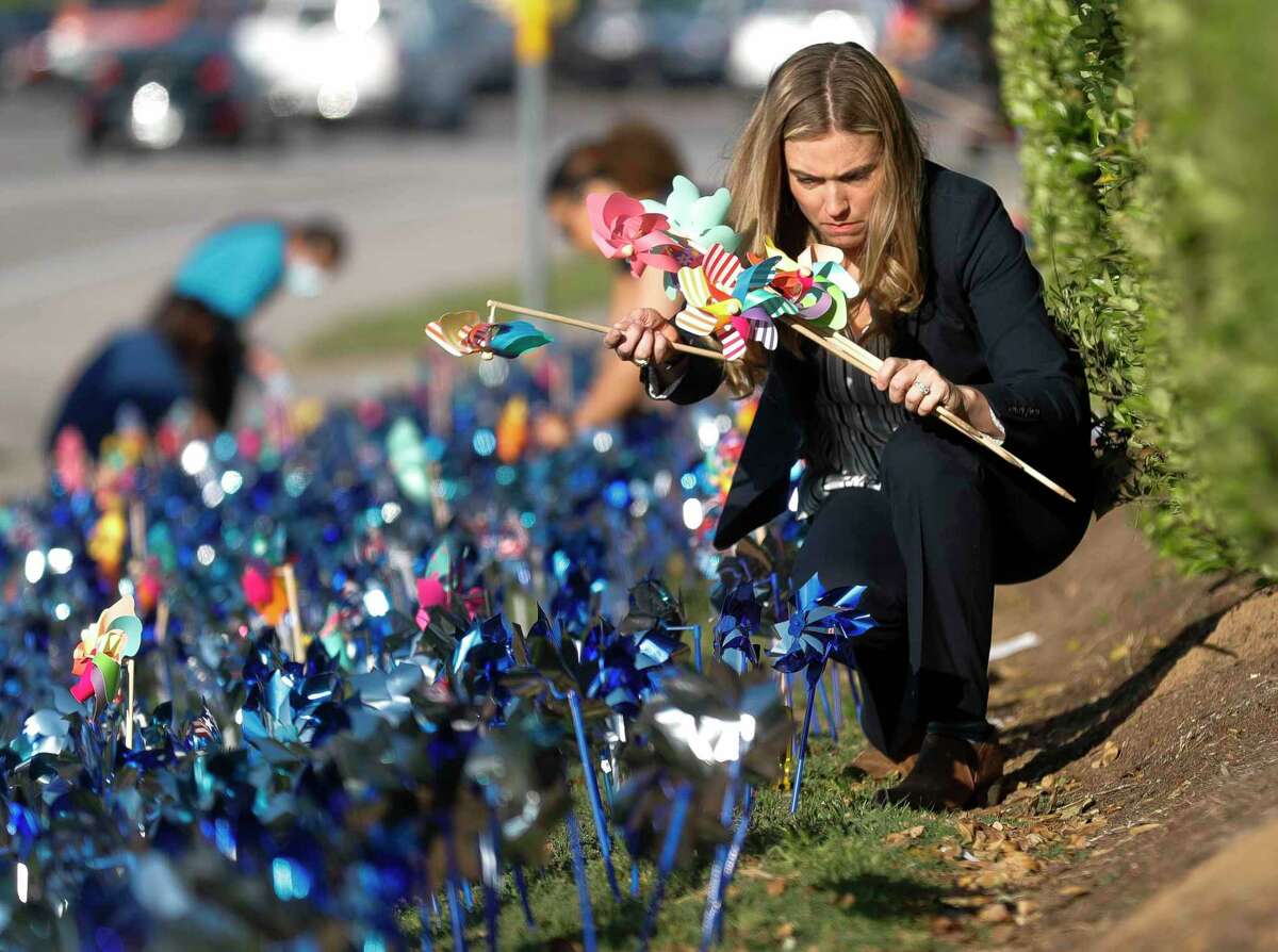 Montgomery County Assistant District Attorney Shanna Redwine helped install pinwheels as volunteers and community members place 2,322 pinwheels along FM 1488 and FM 2978. The annual installation by Children’s Safe Harbor recognizes the number of child cases in Montgomery County and raises awareness of Child Abuse Prevention and Awareness Month.