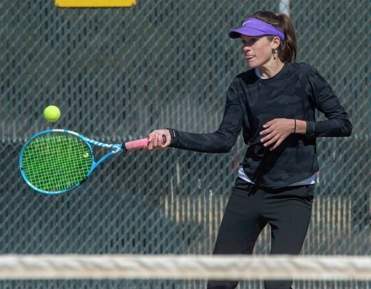 Midland High's Sarah Stewart returns a shot during play in the Tall City Tennis Invitational 02/18/2022 at the Midland College tennis courts. Tim Fischer/Reporter-Telegram