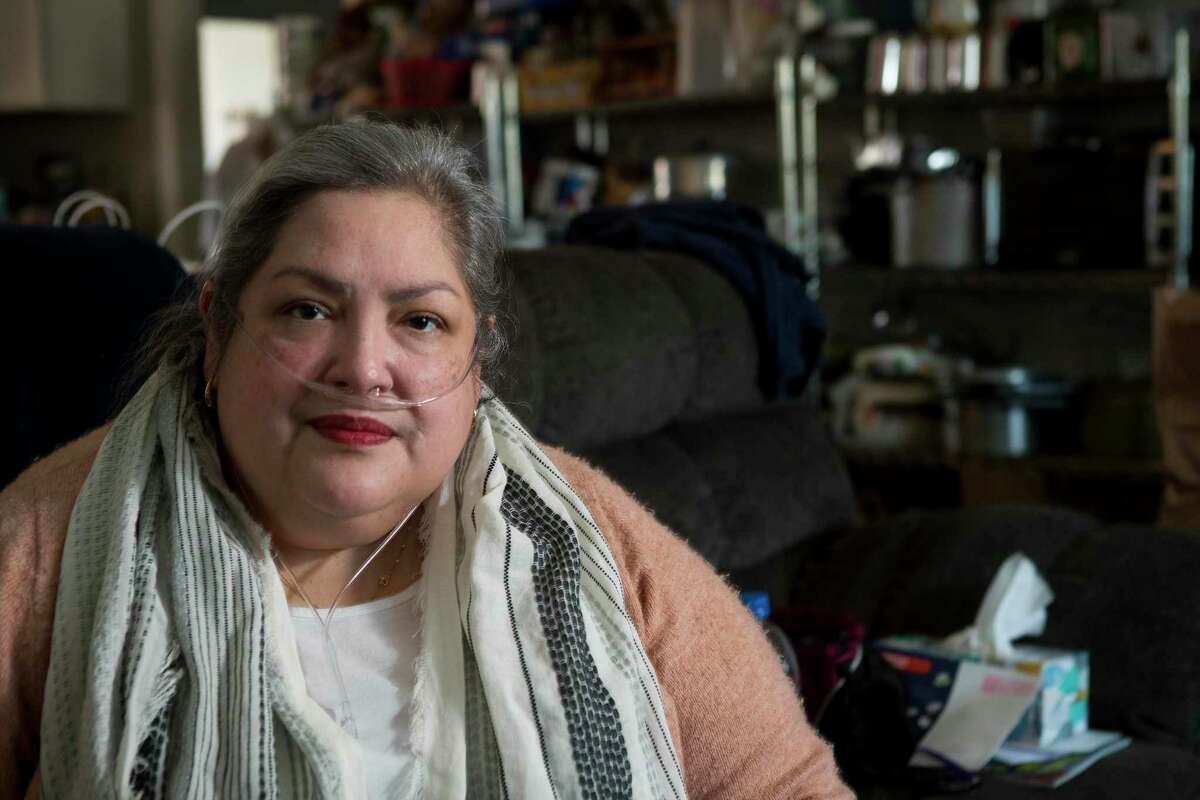 Alice Torres, 54, poses for a portrait in her home Friday, Feb. 19, 2021 in Houston. Torres is just one of so many who have lived through one disaster after another that have happened over the years in Houston.
