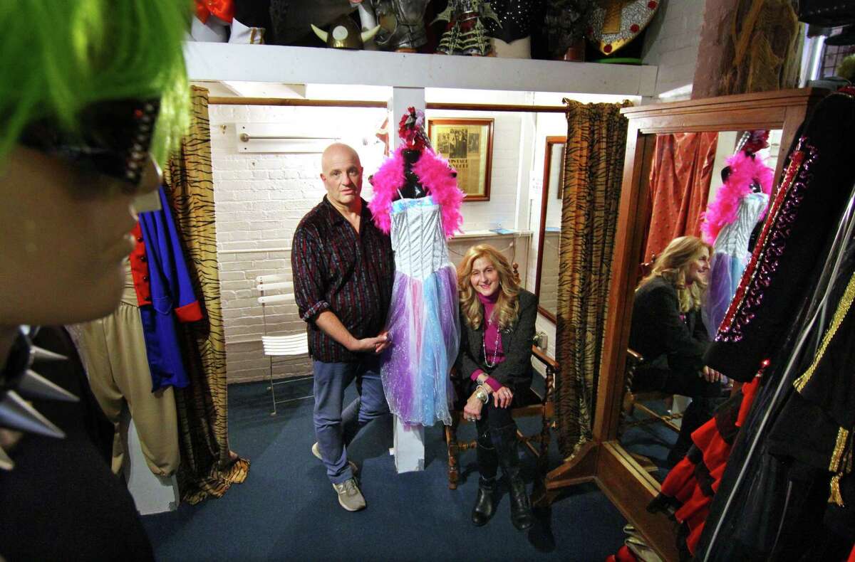 Sophia's Costume manager Glenn Beyus and owner Sophia Scarpelli, pose together at the shop in Greenwich in October 2021. Sophia's Costume celebrated its 40th anniversary in 2021, but the building which once housed the New York Sports Club, and her store, is being re-developed. It may force the popular costume destination to close it doors in the near future.