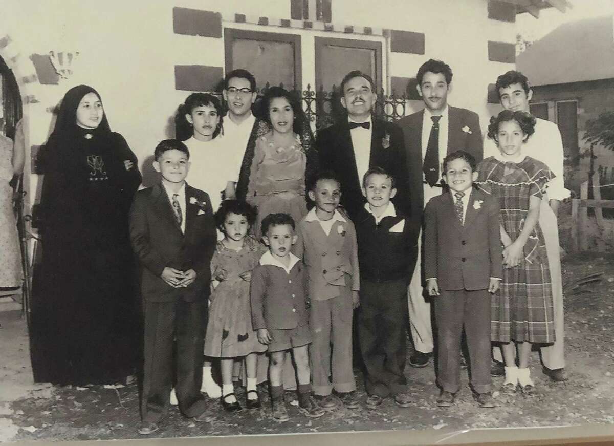 The family of former San Antonio priest Rafael "Ralph" Ruiz, pictured in the back row fourth from the left, was born on the West Side in a devoted Catholic family of 15 children.