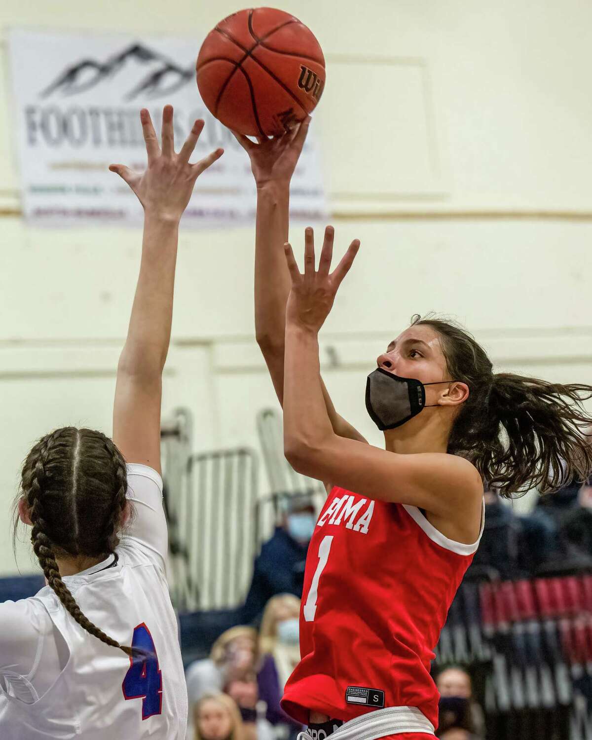 Emma Willard senior Emma Shields takes a jump hook over South Glens Falls junior Kaitlin McDonough during the first round of the Section II, Class A tournament at South Glens Falls High School on Friday, Feb. 18, 2022. (Jim Franco/Special to the Times Union)