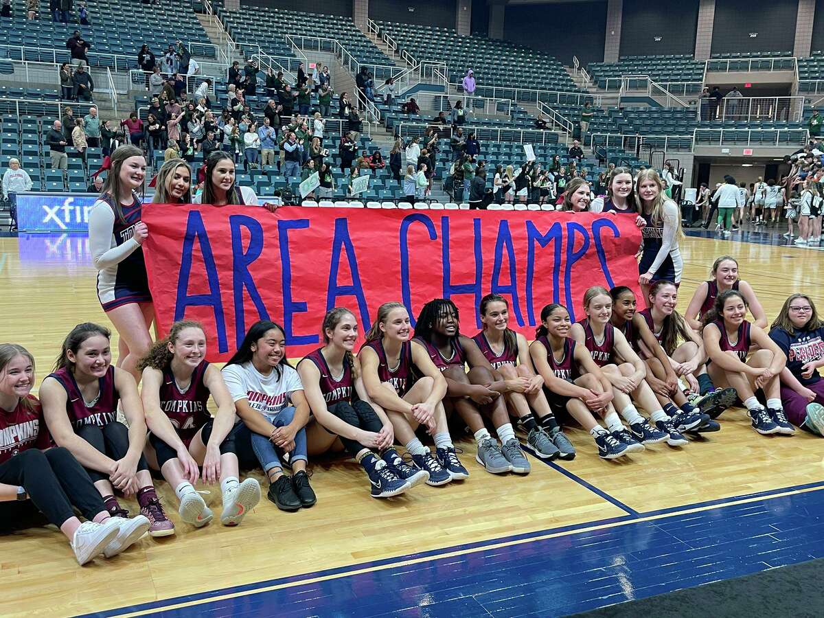 The Tompkins girls basketball team celebrates its 57-51 overtime victory against Stratford in the area round of the Region III-6A playoffs Feb. 18 at Merrell Center.