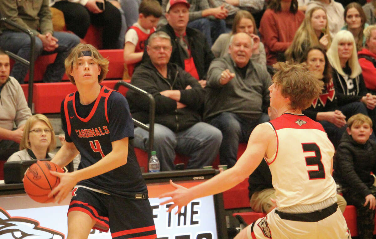 Big Rapids' Mason Dunn (4), guarded by Reed City's Max Hammond in a game earlier this month, scored 26 points at Chippewa Hills on Friday.