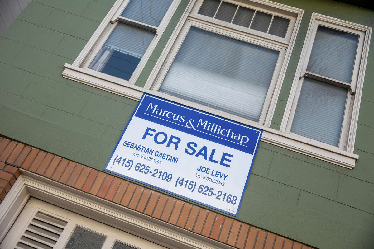 A for sale sign outside a residential building in San Francisco, Calif., on Feb. 15, 2022.