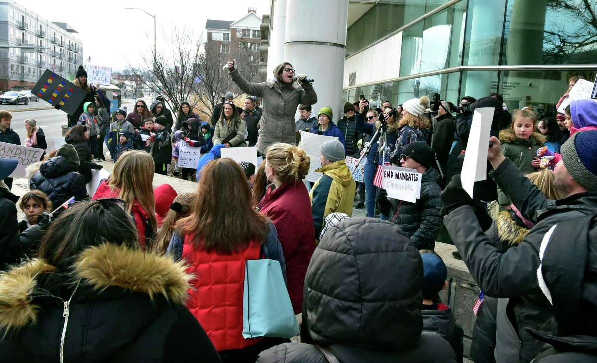 Stephanie Edmonds, with Stamford Parents United, speaks about parent’s rights to anti-mask protesters who gathered in front of the Stamford Government Center Feb. 8.