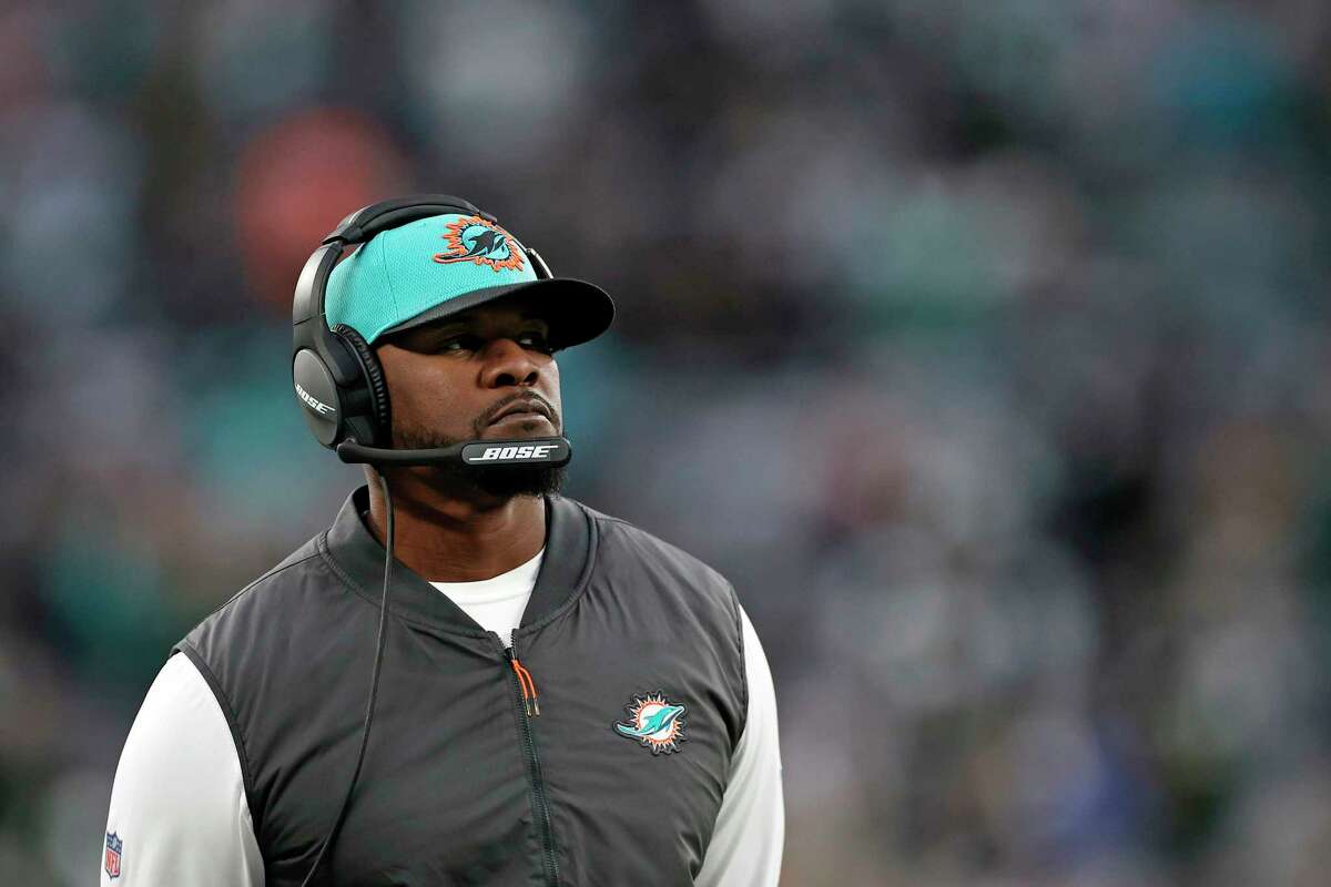 FILE - Miami Dolphins head coach Brian Flores looks on against the New York Jets during an NFL football game, on Nov. 21, 2021, in East Rutherford, N.J. The Pittsburgh Steelers hired the former Miami Dolphins coach on Saturday, Feb. 19, 2022, to serve as a senior defensive assistant. The hiring comes less than three weeks after Flores sued the NFL and three teams over alleged racist hiring practices following his dismissal by Miami in January.