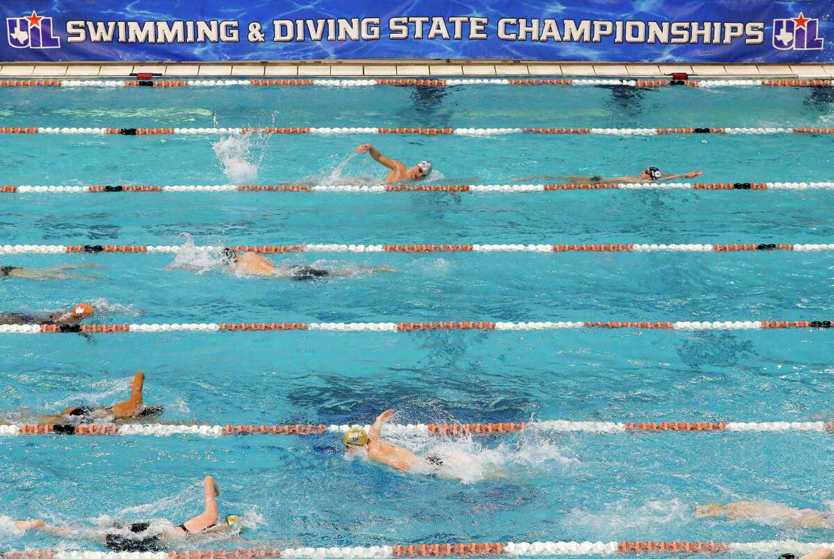 Swimmers warm up before the Class 5A portion of the UIL State Swimming and Diving Championships at Lee & Joe Jamail Texas Swimming Center, Saturday, Feb. 19, 2022, in Austin.